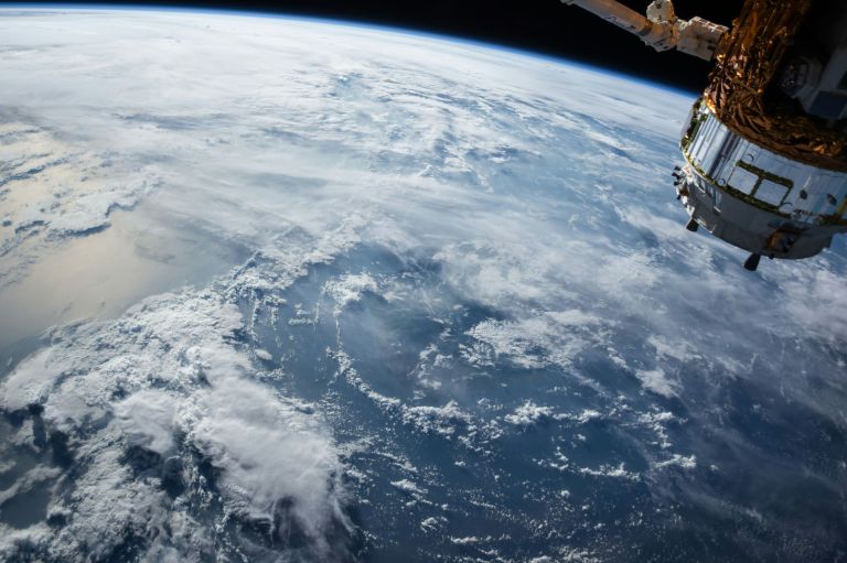 A robotic spacecraft approaching NASA's Neil Gehrels Swift Observatory in Earth orbit for an orbital rescue mission.